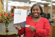 Person holding up Folder and Business card