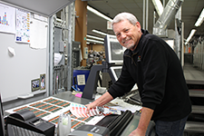 Person running a color check on prints