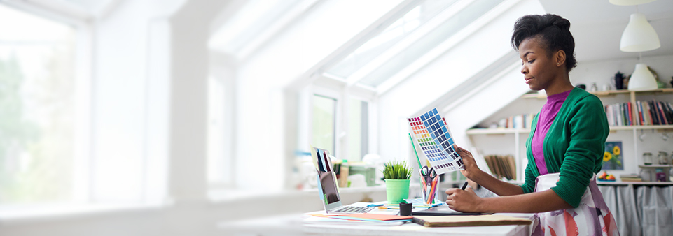 Customer service employee talking on the phone in an office setting